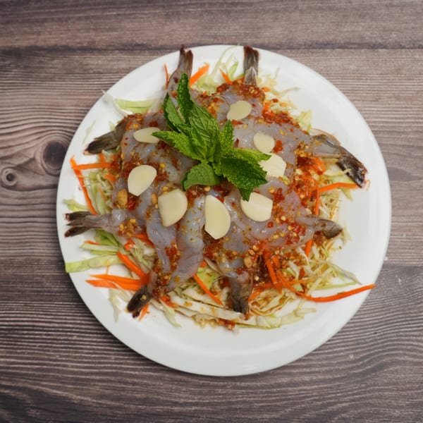 Luv2eat Thai Bistro's raw shrimp with spicy sauce, garlic, and mint on a bed of shredded cabbage.